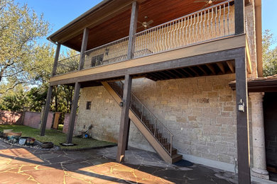 Balcony - mid-sized modern metal railing balcony idea in Austin