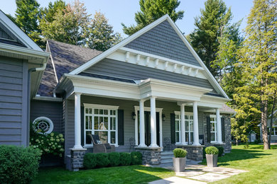 Inspiration for a timeless gray flat roof remodel in Montreal