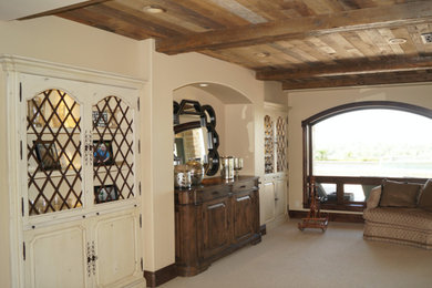 Inspiration for a mid-sized victorian open concept carpeted living room remodel in Los Angeles with a bar, beige walls, no fireplace and no tv