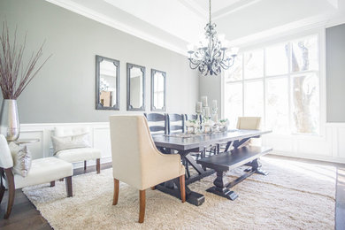 Enclosed dining room - large farmhouse dark wood floor and brown floor enclosed dining room idea in Austin with gray walls