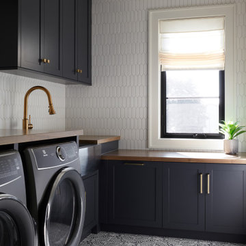 Modern Laundry Room With Navy Blue Cabinets