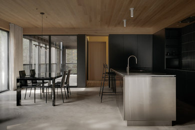 Example of a large minimalist u-shaped kitchen design in Montreal
