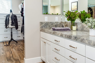 Inspiration for a mid-sized transitional master light wood floor and brown floor bathroom remodel in Sacramento with shaker cabinets, white cabinets, beige walls, an undermount sink, quartzite countertops and gray countertops