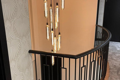 Inspiration for a large classic wood u-shaped metal railing staircase spindle in Cheshire with wood risers.