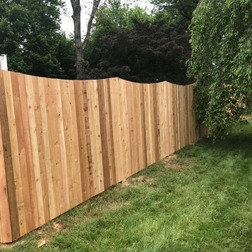 Western Red Cedar Spaced picket fence with French gothic posts and Concave Top