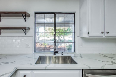 Example of a mid-sized farmhouse l-shaped eat-in kitchen design in Other with shaker cabinets, white cabinets, quartzite countertops, white backsplash, subway tile backsplash, white appliances, an island and white countertops