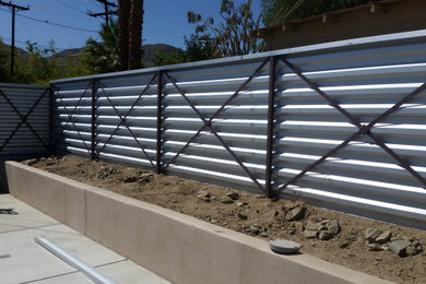 Corrugated/Modern style fencing.