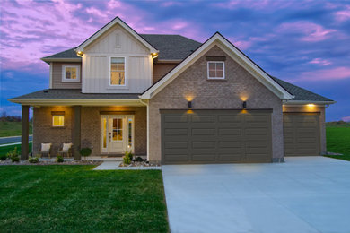 Large modern gray two-story mixed siding and board and batten house exterior idea in Louisville with a hip roof, a shingle roof and a gray roof