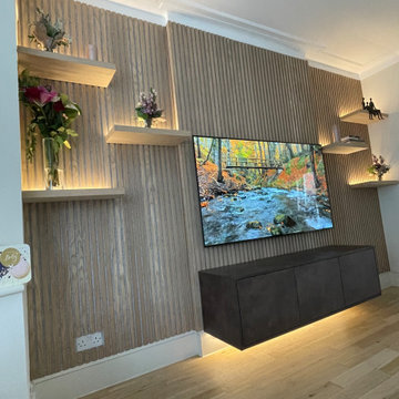 Floating tv unit with floating shelves wall panelling