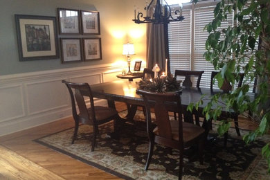 Photo of a mid-sized traditional open plan dining in Nashville with grey walls, light hardwood floors and no fireplace.