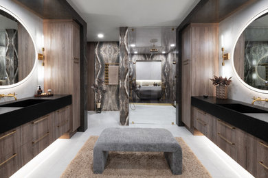 Inspiration for a contemporary master porcelain tile and gray tile porcelain tile, gray floor and double-sink bathroom remodel in Oklahoma City with quartz countertops, a hinged shower door, black countertops, a floating vanity, flat-panel cabinets, dark wood cabinets, gray walls and an integrated sink