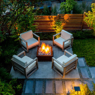 Design ideas for a small contemporary backyard partial sun garden in Seattle with a fire feature and concrete pavers.