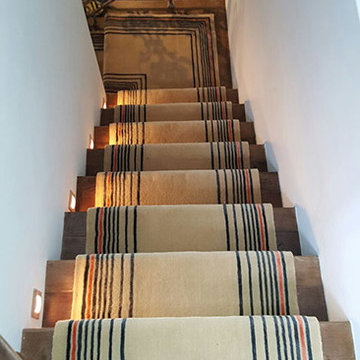 Beige Carpet Installation With Some Stripes to Stairs