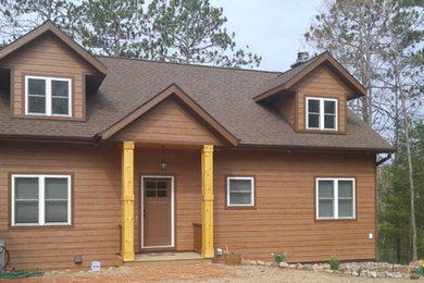 Mid-sized craftsman brown two-story wood gable roof idea in Other