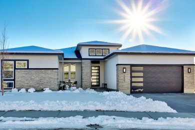 Inspiration for a contemporary white one-story exterior home remodel in Boise