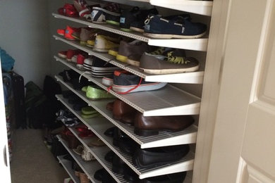 Walk-in closet - mid-sized transitional gender-neutral carpeted and beige floor walk-in closet idea in San Francisco with open cabinets