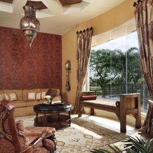 Inspiration for a mediterranean living room in Miami with red walls.