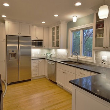 Sink wall with flanking glass door wall cabinets