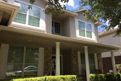 Inspiration for a large timeless multicolored two-story mixed siding exterior home remodel in Austin
