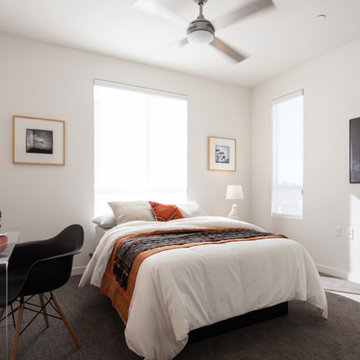 Modern Bedroom with Lucite Desk and Orange Kilim Pillow