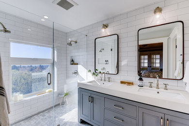 Inspiration for a mid-sized contemporary master white tile and ceramic tile marble floor, white floor and double-sink walk-in shower remodel in San Francisco with shaker cabinets, gray cabinets, a one-piece toilet, white walls, an undermount sink, a hinged shower door, a niche and a freestanding vanity