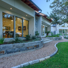 Patio, fire pit, terraced landscape Texas house