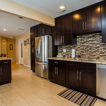 Contemporary Espresso Kitchen Remodel with Granite Counters & Mosaic Backsplash