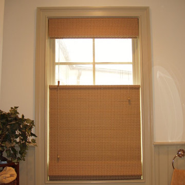 Cozy, traditional Hunter Douglas Woven Shades