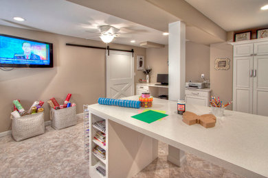 Huge trendy walk-out vinyl floor basement photo in St Louis with beige walls and a standard fireplace