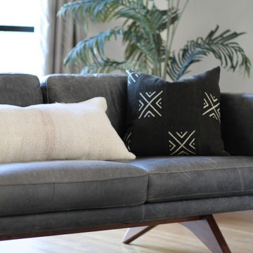 Licorice Color Sofa and Mudcloth Pillow in Historic LA Home
