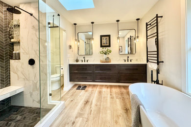 Example of a mid-sized minimalist white tile and porcelain tile vinyl floor, beige floor and double-sink bathroom design in Seattle with shaker cabinets, dark wood cabinets, a two-piece toilet, beige walls, an undermount sink, solid surface countertops, a hinged shower door, white countertops and a floating vanity