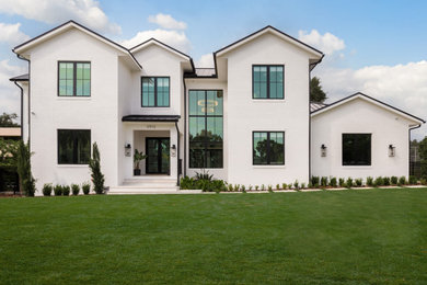 Large transitional two-story brick exterior home photo in Tampa with a metal roof and a black roof
