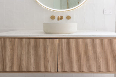 Inspiration for a beach style bathroom in Central Coast with a floating vanity.