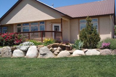 Elegant beige one-story stucco gable roof photo in Denver