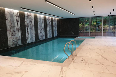 Modern indoor rectangular swimming pool in Cheshire.