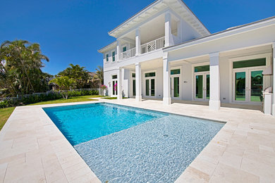 Example of a transitional home design design in Miami