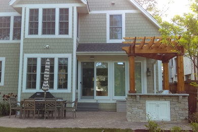 Example of an arts and crafts patio design in Minneapolis