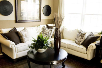Example of a mid-sized transitional open concept dark wood floor and brown floor living room design in New York with beige walls