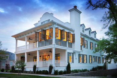 Elegant white two-story brick exterior home photo in Nashville