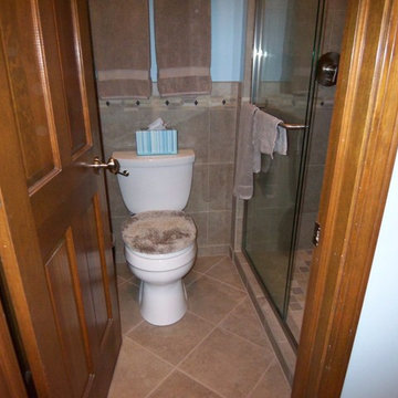 Tiled walls with listel, tieing into shower