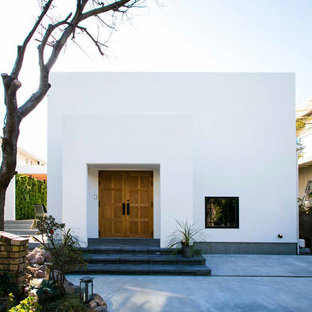 他の地域のアジアンスタイルのおしゃれな家の外観 (漆喰サイディング、陸屋根、戸建) の写真