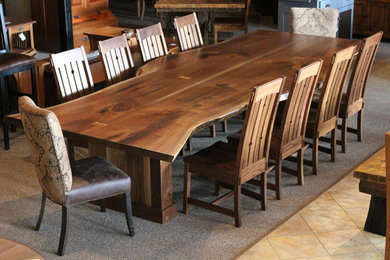 Example of an arts and crafts carpeted and brown floor dining room design in Other