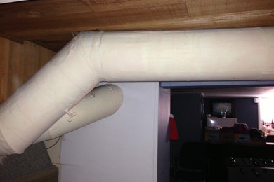 Asbestos insulation around a duct