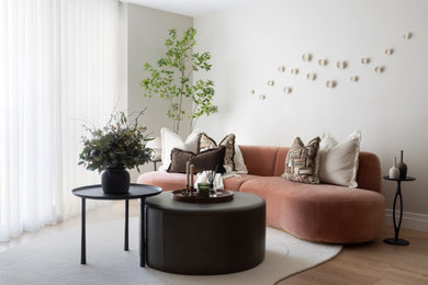 Small modern open plan living room curtain in London with beige walls.