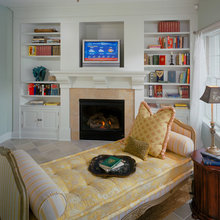 chaise and cabinet around fireplace