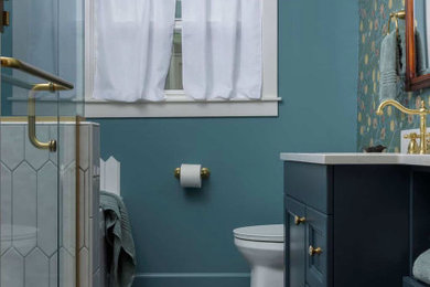 Small trendy kids' white tile and ceramic tile ceramic tile, multicolored floor and single-sink bathroom photo in Baltimore with recessed-panel cabinets, blue cabinets, a two-piece toilet, green walls, an undermount sink, quartz countertops, a hinged shower door, white countertops and a freestanding vanity