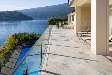Example of a large trendy backyard deck design in Vancouver with no cover