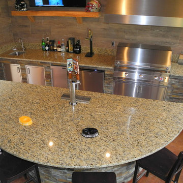 Outdoor kitchen with Solaire Grill, Evo Cooktop, kegerator and more!