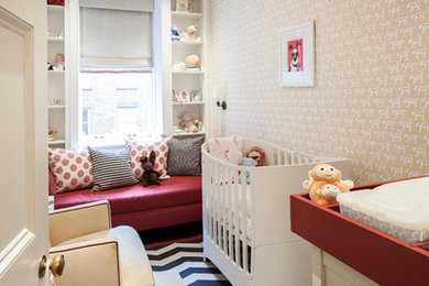 Example of a transitional gender-neutral carpeted nursery design in New York with multicolored walls