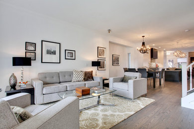 Example of a transitional home design design in Calgary